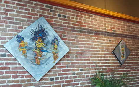 Paintings of Aztec/Mexika dancers at La Peña Cultural Center