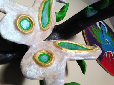 close up of butterfly wings on cartoneria paper sculpture